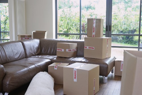 Professional movers carrying furniture during a Bexley house move